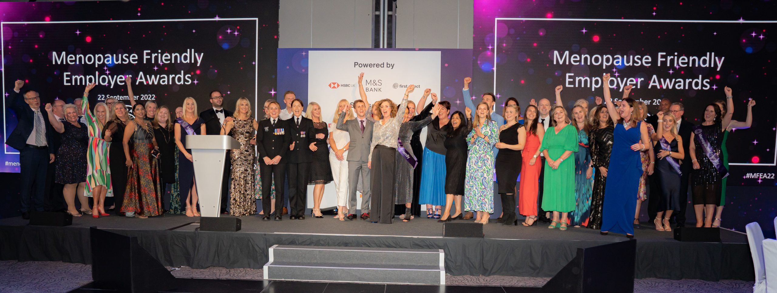 Award-Winning Employers celebrating on stage at The Menopause Friendly Employer Awards 2022